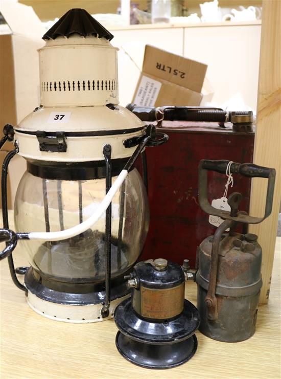 An early 20th century petrol canister, a klaxonet horn, a lantern and one other item